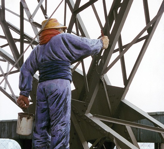 Photo of a statue of painter at the Eiffel Tower